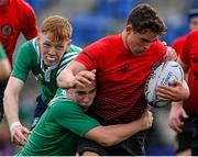 28 October 2021; Tadgh Duff of North East is tackled by Cian Cashman of South East during the Shane Horgan Cup Third Round match between South East and North East at Energia Park in Dublin. Photo by Brendan Moran/Sportsfile
