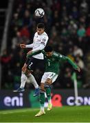 15 November 2021; Giovanni Di Lorenzo of Italy wins the ball in the air over Jamal Lewis of Northern Ireland during the FIFA World Cup 2022 Qualifier match between Northern Ireland and Italy at the National Football Stadium at Windsor Park in Belfast. Photo by David Fitzgerald/Sportsfile