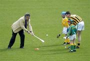 30 March 2004; McDonald's Restaurants of Ireland and the GAA today launched an innovative campaign to improve the hurling and camogie skills of thousands of primary school children across Ireland. Pictured at the launch are Marcus Hewson, left, Managing Director, McDonald's Restaurants Ireland,  Kilkenny captain Martin Comerford, James Tyrrell (green jersey), Dublin, and Sean Healy, Dublin. Croke Park, Dublin. Picture credit; Ray McManus / SPORTSFILE *EDI*