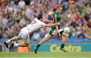 27 July 2013; Eamonn Wallace, Meath, shoots to score his side's first goal despite the attention of Ryan McKenna, Tyrone. GAA Football All-Ireland Senior Championship, Round 4, Meath v Tyrone, Croke Park, Dublin. Picture credit: Stephen McCarthy / SPORTSFILE