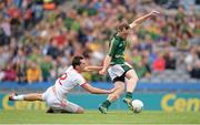 27 July 2013; Eamonn Wallace, Meath, shoots to score his side's first goal despite the attention of Ryan McKenna, Tyrone. GAA Football All-Ireland Senior Championship, Round 4, Meath v Tyrone, Croke Park, Dublin. Picture credit: Stephen McCarthy / SPORTSFILE