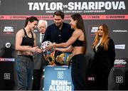 10 December 2021; Katie Taylor, left, is presented with a football by Firuza Sharipova during weigh ins ahead of their Undisputed Lightweight Championship bout at The Black-E in Liverpool, England. Photo by Stephen McCarthy/Sportsfile