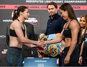10 December 2021; Katie Taylor, left, and Firuza Sharipova during weigh ins ahead of their Undisputed Lightweight Championship bout at The Black-E in Liverpool, England. Photo by Stephen McCarthy/Sportsfile