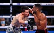 11 December 2021; Caoimhin Agyarko, right, and Noe Larios Jr during their vacant WBA International Middleweight Title bout at M&S Bank Arena in Liverpool, England. Photo by Stephen McCarthy/Sportsfile