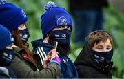 11 December 2021; Leinster supporters wear facemasks before the Heineken Champions Cup Pool A match between Leinster and Bath at Aviva Stadium in Dublin. Photo by Brendan Moran/Sportsfile