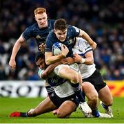 11 December 2021; Garry Ringrose of Leinster is tackled by Max Ojomoh, left, and Will Butt of Bath during the Heineken Champions Cup Pool A match between Leinster and Bath at Aviva Stadium in Dublin. Photo by Brendan Moran/Sportsfile