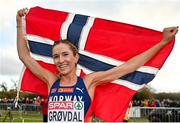 12 December 2021; Karoline Bjerkeli Grøvdal of Norway celebrates after winning the Senior Women's 8000m final during the SPAR European Cross Country Championships Fingal-Dublin 2021 at the Sport Ireland Campus in Dublin. Photo by Seb Daly/Sportsfile