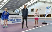 3 January 2022; Sienna MacCarthy, left, and Alicia Sutton, pictured with their medals alongside Tennis Ireland Competitions Manager Simon Honan after the Girls U12 Singles Final match during the Shared Access National Indoor Tennis Championships 2022 at David Lloyd Riverview in Dublin. Photo by Sam Barnes/Sportsfile