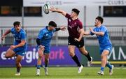 7 January 2022; Ben Brownlee of Ireland offloads under pressure from Chris Cosgrave and David Dooley of Leinster during a development match between Leinster A and Ireland U20 at Energia Park in Dublin. Photo by Harry Murphy/Sportsfile