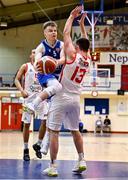 9 January 2022; Matthew McCarthy of UCC Demons in action against Colm Blount of Ballincollig BC during the Basketball Ireland Men's U20 Cup semi-final match between UCC Blue Demons and Ballincollig BC at Neptune Stadium in Cork. Photo by Brendan Moran/Sportsfile