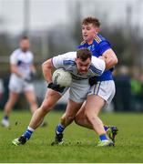 15 January 2022; Eoin Lowry of Laois in action against Darragh Fitzgerald of Wicklow during the O'Byrne Cup Group B match between Laois and Wicklow at Crettyard GAA Club in Laois. Photo by Daire Brennan/Sportsfile