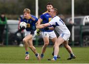 15 January 2022; Andy Maher of Wicklow in action against Paul Kingston of Laois during the O'Byrne Cup Group B match between Laois and Wicklow at Crettyard GAA Club in Laois. Photo by Daire Brennan/Sportsfile