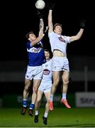 19 January 2022; Trevor Collins of Laois in action against Daniel Flynn of Kildare during the O'Byrne Cup Semi-Final match between Laois and Kildare at Netwatch Cullen Park in Carlow. Photo by Seb Daly/Sportsfile