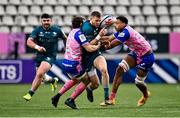 23 January 2022; Diarmuid Kilgallen of Connacht is tackled by Nicolas Sanchez, left, and Charlie Francoz of Stade Francais Paris during the Heineken Champions Cup Pool A match between Stade Francais Paris and Connacht at Stade Jean Bouin in Paris, France. Photo by Seb Daly/Sportsfile