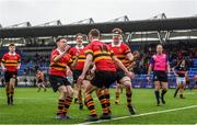 1 February 2022; David Finnegan of CBC Monkstown, 14, celebrates after scoring his side's second try with teammates including Eoghan O'Hanlon, left, during the Bank of Ireland Vinnie Murray Cup 2nd Round match between CBC Monkstown and The High School at Energia Park in Dublin. Photo by Harry Murphy/Sportsfile