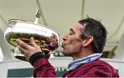 5 February 2022; Jockey Davy Russell kisses the trophy after winning the Paddy Power Irish Gold Cup on Conflated during day one of the Dublin Racing Festival at Leopardstown Racecourse in Dublin. Photo by Seb Daly/Sportsfile