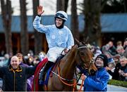 6 February 2022; Jockey Rachael Blackmore celebrates as she is lead into the winners enclosure after winning the Chanelle Pharma Irish Champion Hurdle on Honeysuckle during day two of the Dublin Racing Festival at Leopardstown Racecourse in Dublin. Photo by Seb Daly/Sportsfile