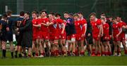 9 February 2022; The CUS team, right, and Temple Carrig teams shake hands after  the Bank of Ireland Vinnie Murray Cup Semi-Final match between Temple Carrig and CUS at Coolmine RFC in Dublin. Photo by Brendan Moran/Sportsfile