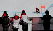 10 February 2022; Volunteers and support staff watch on during the run of Brodie Seger of Canada during the Men's Alpine Combined Downhill event on day six of the Beijing 2022 Winter Olympic Games at National Alpine Skiing Centre in Yanqing, China. Photo by Ramsey Cardy/Sportsfile