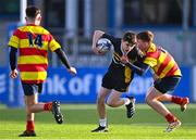 10 February 2022; Eoin Burke of St Patrick's Classical School Navan is tackled by Corey O'Brien of Temple Carrig during the Bank of Ireland Fr Godfrey Cup Semi-Final match between Temple Carrig and St Patrick's Classical School Navan at Energia Park in Dublin. Photo by Piaras Ó Mídheach/Sportsfile