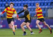 10 February 2022; Ivo FitzHerbert of St Patrick's Classical School Navan passes under pressure from Darragh Shanahan of Temple Carrig, left, during the Bank of Ireland Fr Godfrey Cup Semi-Final match between Temple Carrig and St Patrick's Classical School Navan at Energia Park in Dublin. Photo by Piaras Ó Mídheach/Sportsfile