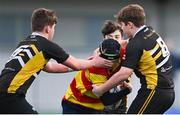 10 February 2022; Alec Bartak of Temple Carrig is tackled by Robbie Davis, left, and Ciaran Scott of St Patrick's Classical School Navan during the Bank of Ireland Fr Godfrey Cup Semi-Final match between Temple Carrig and St Patrick's Classical School Navan at Energia Park in Dublin. Photo by Piaras Ó Mídheach/Sportsfile