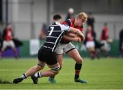 17 February 2022; Sean Foulds of Wesley College is tackled by Richie Whelan of Cistercian College during the Bank of Ireland Leinster Rugby Schools Senior Cup 1st Round match between Cistercian College, Roscrea and Wesley College at Energia Park in Dublin. Photo by David Fitzgerald/Sportsfile