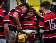 17 February 2022; Wesley College players celebrate with their captain Dan Campbell, centre, who was injured during the game after the Bank of Ireland Leinster Rugby Schools Senior Cup 1st Round match between Cistercian College, Roscrea and Wesley College at Energia Park in Dublin. Photo by David Fitzgerald/Sportsfile