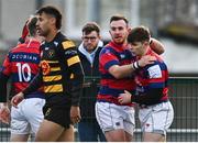 19 February 2022; Tadhg Bird of Clontarf, right, celebrates with teammates after scoring their side's first try during the Energia All-Ireland League Division 1A match between Clontarf and Young Munster at Castle Avenue in Dublin. Photo by Sam Barnes/Sportsfile