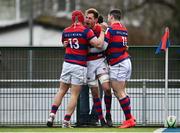 19 February 2022; Adrian D'Arcy of Clontarf celebrates with teammates Michael Courtney, left, and Cian O'Donogue after scoring their side's third try during the Energia All-Ireland League Division 1A match between Clontarf and Young Munster at Castle Avenue in Dublin. Photo by Sam Barnes/Sportsfile