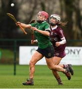 20 February 2022; Orlaith McGrath of Sarsfields in action against Cliona Mulholland of Slaughtneil during the AIB All-Ireland Senior Camogie Club Championship Semi-Final match between Sarsfields and Slaughtneil at Naomh Eanna in Gorey, Wexford. Photo by Matt Browne/Sportsfile