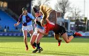 24 February 2022; Robyn O’Connor of South East is tackled by Anna Hiliard of North East during the Bank of Ireland Leinster Rugby Sarah Robinson Cup Round 3 match between South East and North East at Energia Park in Dublin. Photo by Seb Daly/Sportsfile