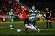 25 February 2022; Jamie McGonigle of Derry City is fouled by Jack Byrne of Shamrock Rovers, resulting in a penalty, during the SSE Airtricity League Premier Division match between Derry City and Shamrock Rovers at The Ryan McBride Brandywell Stadium in Derry. Photo by Stephen McCarthy/Sportsfile