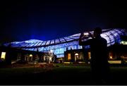 28 February 2022; Havelock Square resident Jay Boyne takes a photograph of the Aviva Stadium, in Dublin, which is illuminated in blue and yellow as a show of solidarity with the people of Ukraine. Russia launched a full-scale military invasion into Ukraine territory on February 24, 2022. Photo by David Fitzgerald/Sportsfile