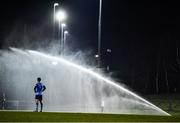 28 February 2022; Evan Osam of UCD watches on as a sprinkler interrupts play during the SSE Airtricity League Premier Division match between UCD and Shelbourne at UCD Bowl in Belfield, Dublin. Photo by Harry Murphy/Sportsfile