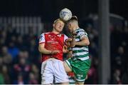 4 March 2022; Tom Grivosti of St Patrick's Athletic in action against Andy Lyons of Shamrock Rovers during the SSE Airtricity League Premier Division match between St Patrick's Athletic and Shamrock Rovers at Richmond Park in Dublin. Photo by Seb Daly/Sportsfile