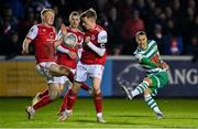 4 March 2022; Graham Burke of Shamrock Rovers takes a shot under pressure from Tom Grivosti and Chris Forrester of St Patrick's Athletic during the SSE Airtricity League Premier Division match between St Patrick's Athletic and Shamrock Rovers at Richmond Park in Dublin. Photo by Seb Daly/Sportsfile
