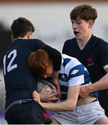 10 March 2022; Charlie Keogh of Blackrock College is tackled by Christopher MacLachlann Hickey of Wesley College during the Bank of Ireland Leinster Rugby Schools Junior Cup 2nd Round match between Blackrock College and Wesley College at Energia Park in Dublin. Photo by Harry Murphy/Sportsfile