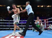 12 March 2022; Michael Conlan is knocked down by Leigh Wood in the eleventh round of their WBA Featherweight title bout at the Motorpoint Arena in Nottingham, England. Photo by Mark Robinson / Matchroom Boxing via Sportsfile