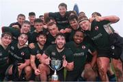 13 March 2022; Queen's University Belfast players celebrate with the cup after the Maxol Maughan Scally Cup Final match between Queen's University Belfast and NUI Galway at UCD in Dublin. Photo by Michael P Ryan/Sportsfile