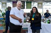 19 March 2022; Joanne Foster of Willowfield Harriers, Down, is presented the Top Cross Country Club award by Athletics Ireland President John Cronin during day one of the Irish Life Health National Juvenile Indoors at Athlone Institute of Technology in Athlone, Westmeath. Photo by Ben McShane/Sportsfile