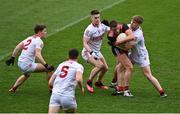 20 March 2022; Pat Havern of Down under pressure from Cork defenders, from left, Kevin O’Donovan, Rory Maguire, Kevin Flahive and John Cooper during the Allianz Football League Division 2 match between Cork and Down at Páirc Uí Chaoimh in Cork. Photo by Brendan Moran/Sportsfile