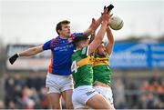 20 March 2022; Armagh goalkeeper Ethan Rafferty in action against Joe O'Connor, centre, and Micheal Burns of Kerry during the Allianz Football League Division 1 match between Armagh and Kerry at the Athletic Grounds in Armagh. Photo by Ramsey Cardy/Sportsfile