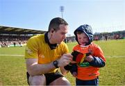 20 March 2022; Referee Martin McNally with match mascot Dáithí Mac Gabhann before the Allianz Football League Division 1 match between Armagh and Kerry at the Athletic Grounds in Armagh. Photo by Ramsey Cardy/Sportsfile