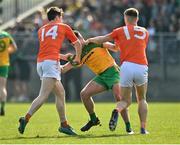 27 March 2022; Andrew Murnin and Rian O'Neill of Armagh in an second half  incident with Brendan McCole of Donegal during the Allianz Football League Division 1 match between Donegal and Armagh at O'Donnell Park in Letterkenny, Donegal. Photo by Oliver McVeigh/Sportsfile