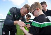28 March 2022; Goalkeeper James Talbot signs autographs for players from Mourne Celtic, Drimnagh, after a Republic of Ireland training session at FAI National Training Centre in Dublin. Photo by Eóin Noonan/Sportsfile