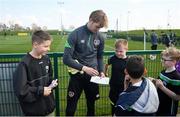 28 March 2022; Goalkeeper Caoimhin Kelleher signs autographs for players from Mourne Celtic, Drimnagh, after a Republic of Ireland training session at FAI National Training Centre in Dublin. Photo by Eóin Noonan/Sportsfile