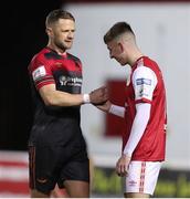 1 April 2022; Dane Massey, left, of Drogheda United with Darragh Burns of St Patrick's Athletic after the SSE Airtricity League Premier Division match between St Patrick's Athletic and Drogheda United at Richmond Park in Dublin. Photo by Michael P Ryan/Sportsfile