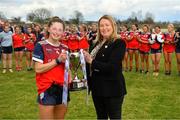 2 April 2022; St Mary's Midleton captain Dara Kiniry is presented with cup by Trina Murray, Leinster LGFA President, after the Lidl All-Ireland PPS Senior A Final match between Moate Community School and St. Marys High School Midleton at Bruff GAA in Limerick. Photo by Diarmuid Greene/Sportsfile