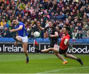 3 April 2022; David Clifford of Kerry shoots past Pádraig O'Hora and Mayo goalkeeper Rory Byrne to score his side's third goal, in the 66th minute, during the Allianz Football League Division 1 Final match between Kerry and Mayo at Croke Park in Dublin. Photo by Ray McManus/Sportsfile